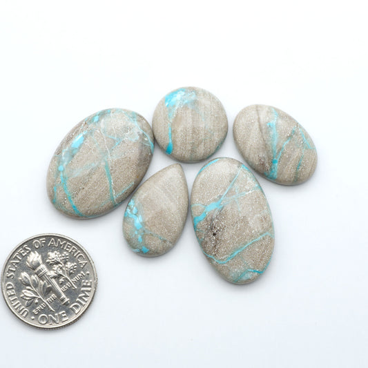 Carico Lake Turquoise cabochons with vibrant aqua-blue to turquoise tones and natural matrix, ideal for rings, pendants, and artisan jewelry.