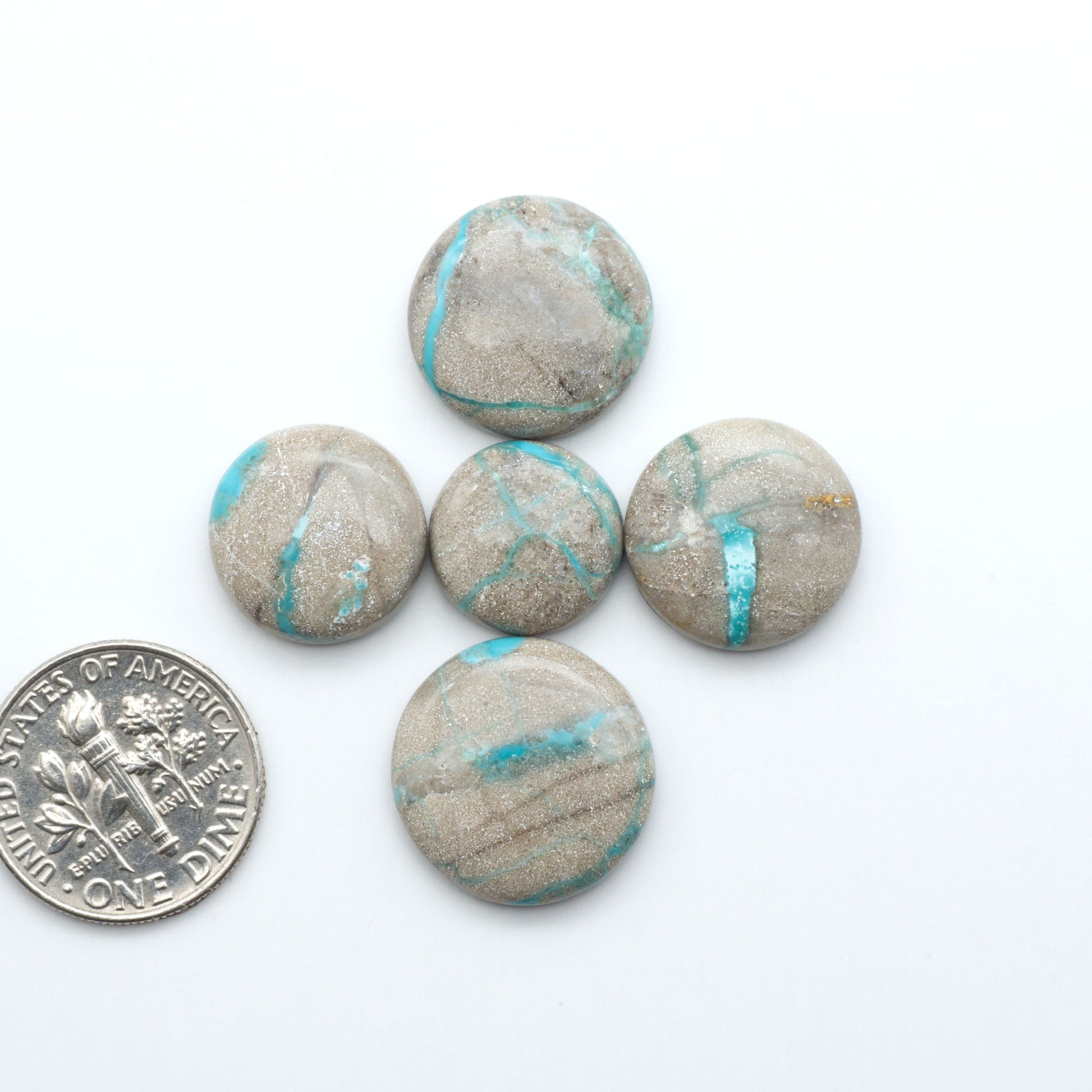 Carico Lake Turquoise cabochons with vibrant aqua-blue to turquoise tones and natural matrix, ideal for rings, pendants, and artisan jewelry.