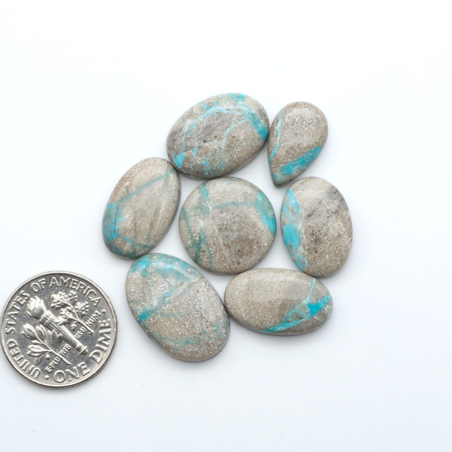 Carico Lake Turquoise cabochons with vibrant aqua-blue to turquoise tones and natural matrix, ideal for rings, pendants, and artisan jewelry.