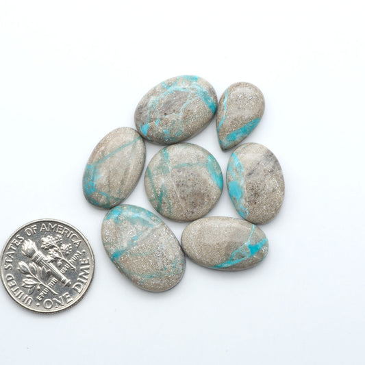Carico Lake Turquoise cabochons with vibrant aqua-blue to turquoise tones and natural matrix, ideal for rings, pendants, and artisan jewelry.
