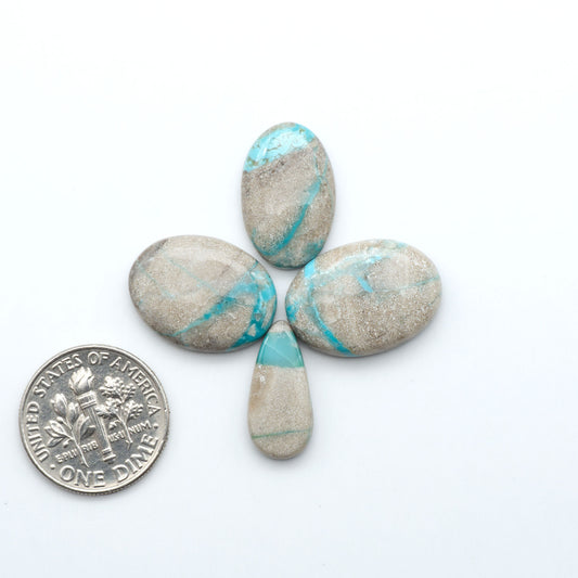 Carico Lake Turquoise cabochons with vibrant aqua-blue to turquoise tones and natural matrix, ideal for rings, pendants, and artisan jewelry.