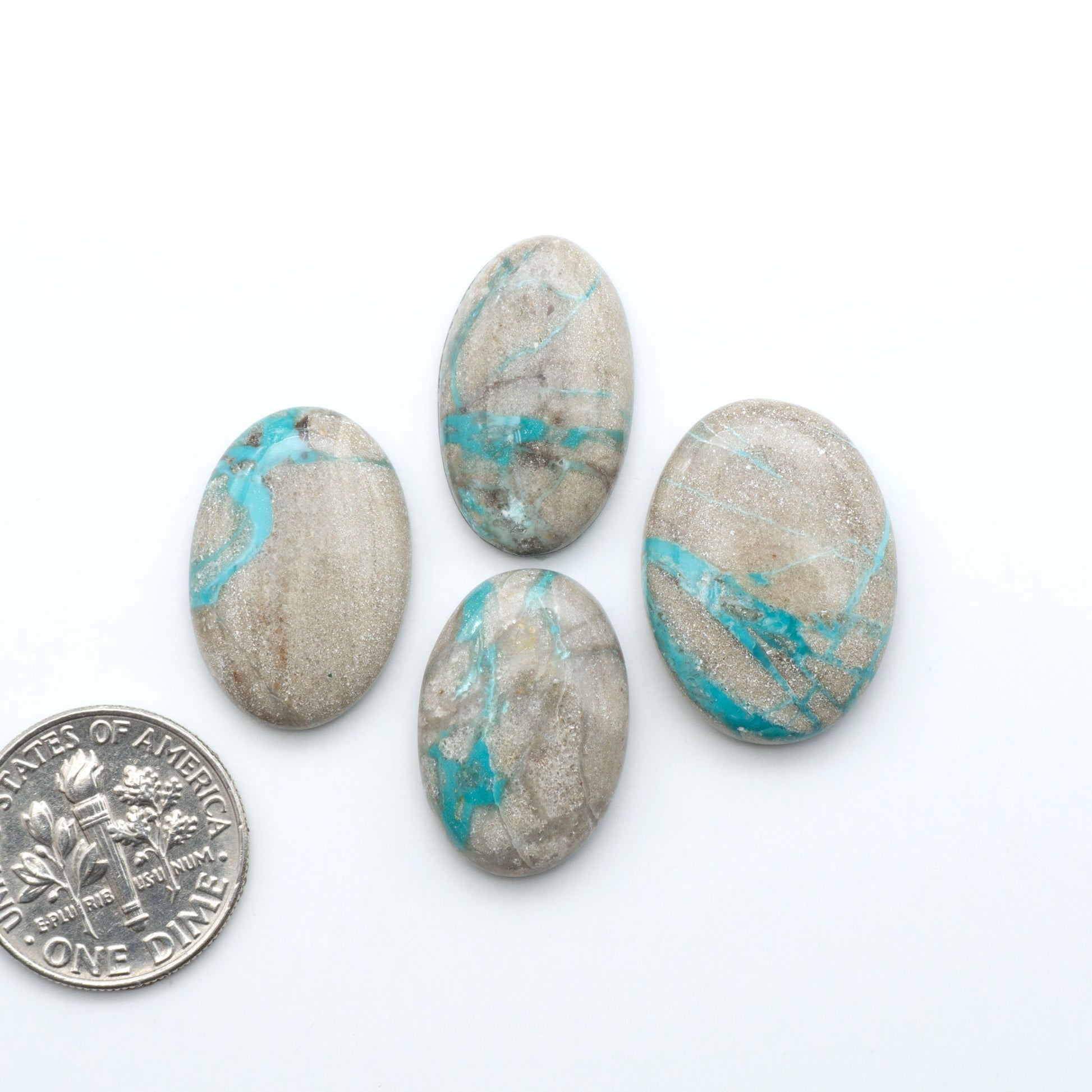 Carico Lake Turquoise cabochons with vibrant aqua-blue to turquoise tones and natural matrix, ideal for rings, pendants, and artisan jewelry.