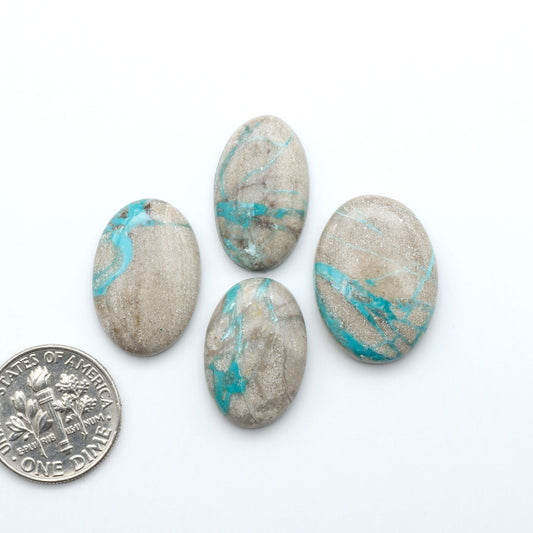 Carico Lake Turquoise cabochons with vibrant aqua-blue to turquoise tones and natural matrix, ideal for rings, pendants, and artisan jewelry.
