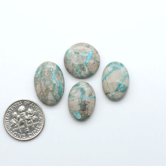 Carico Lake Turquoise cabochons with vibrant aqua-blue to turquoise tones and natural matrix, ideal for rings, pendants, and artisan jewelry.