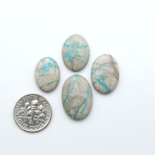 Carico Lake Turquoise cabochons with vibrant aqua-blue to turquoise tones and natural matrix, ideal for rings, pendants, and artisan jewelry.