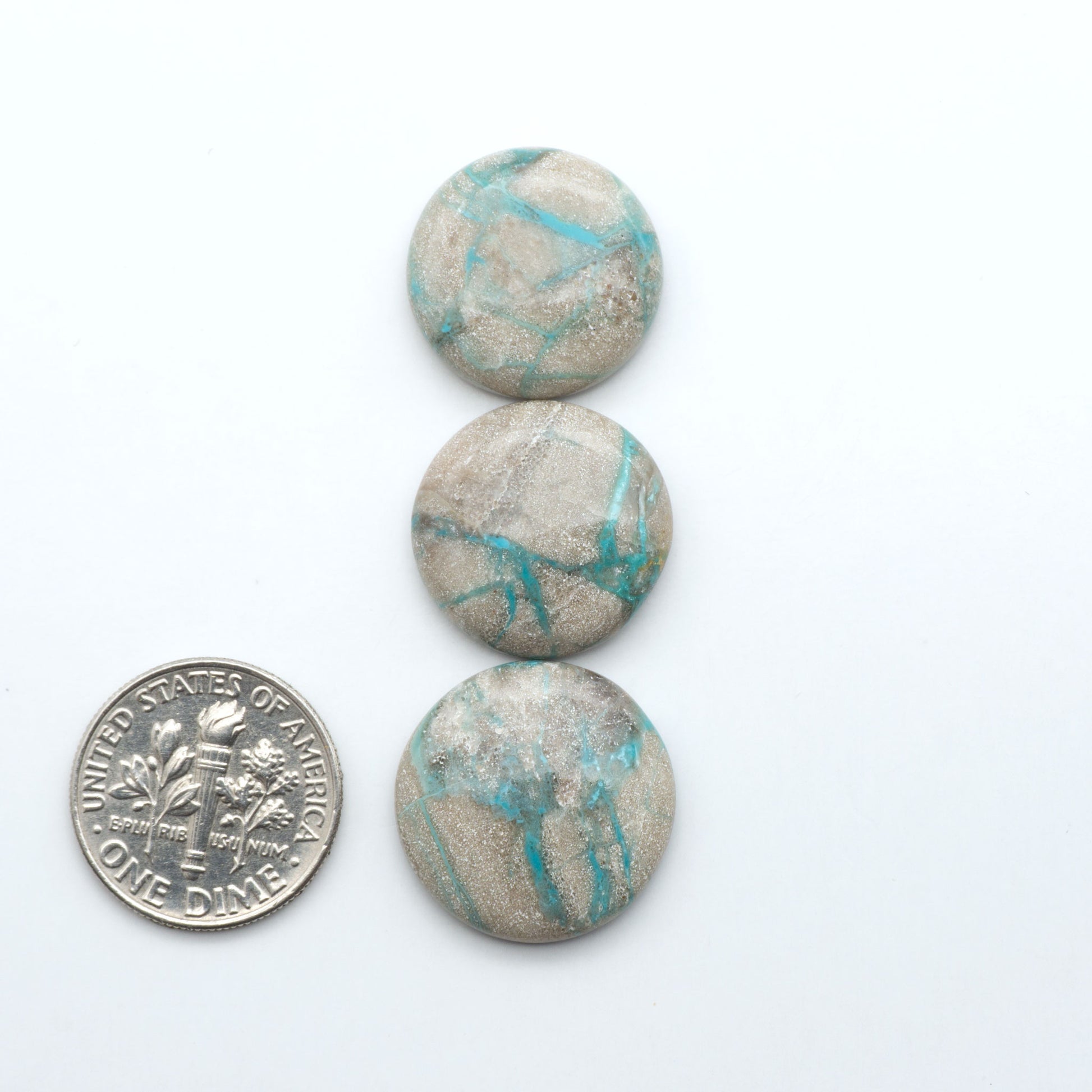 Carico Lake Turquoise cabochons with vibrant aqua-blue to turquoise tones and natural matrix, ideal for rings, pendants, and artisan jewelry.