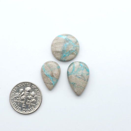 Carico Lake Turquoise cabochons with vibrant aqua-blue to turquoise tones and natural matrix, ideal for rings, pendants, and artisan jewelry.