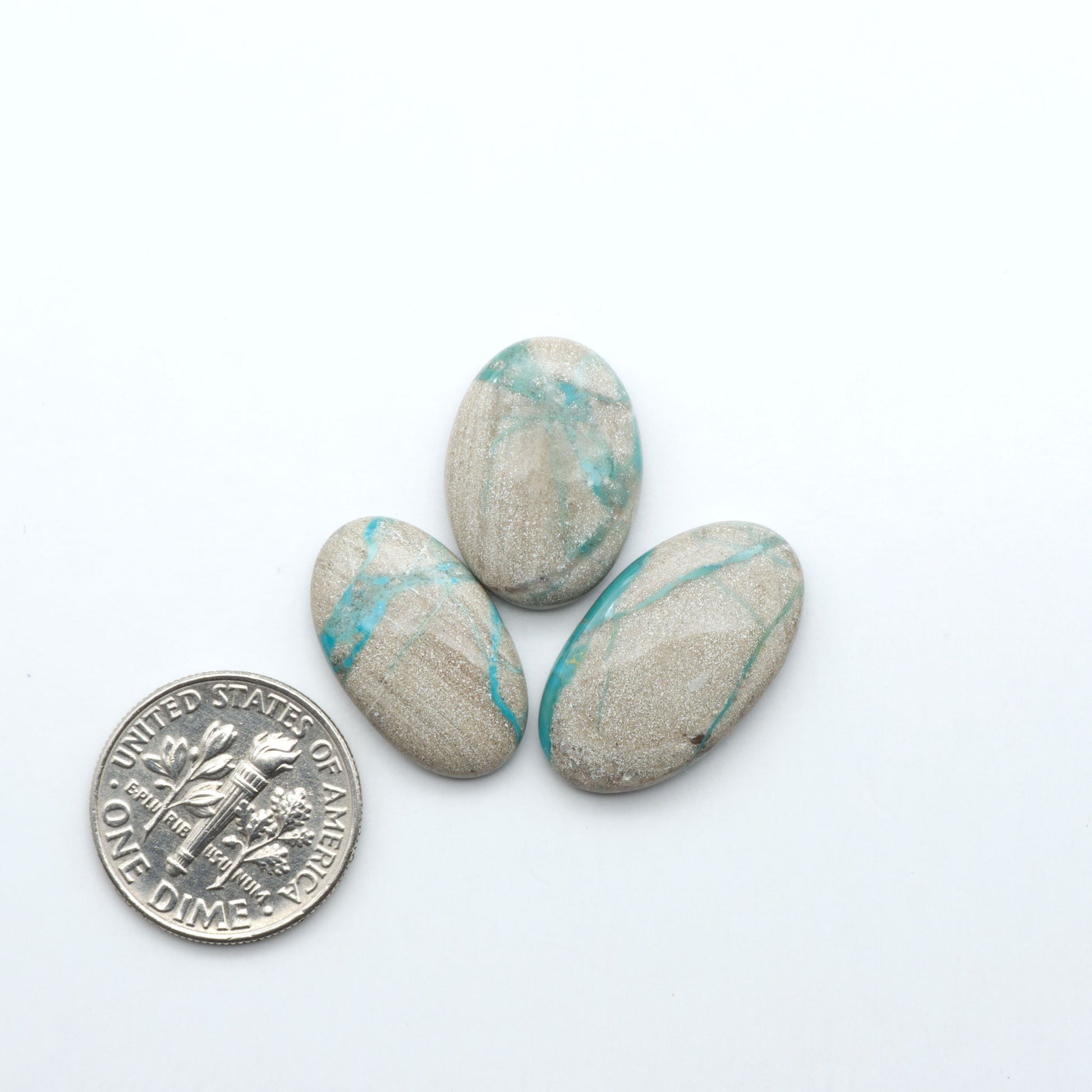 Carico Lake Turquoise cabochons with vibrant aqua-blue to turquoise tones and natural matrix, ideal for rings, pendants, and artisan jewelry.