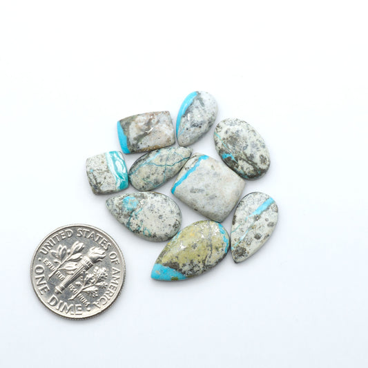 Royston Turquoise cabochons are famous for their distinctive matrix and unique green and blue hues, making them a favored option among jewelry designers.