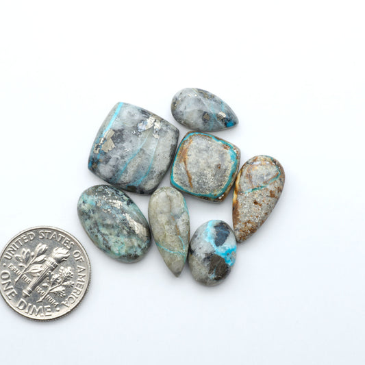 Royston Turquoise cabochons are famous for their distinctive matrix and unique green and blue hues, making them a favored option among jewelry designers.