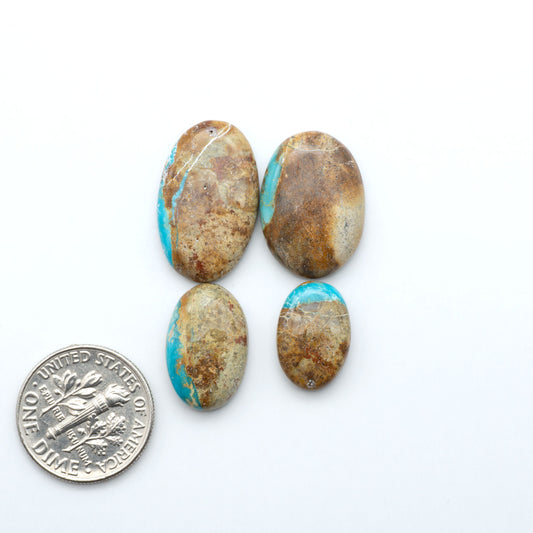 Royston Turquoise cabochons are famous for their distinctive matrix and unique green and blue hues, making them a favored option among jewelry designers.