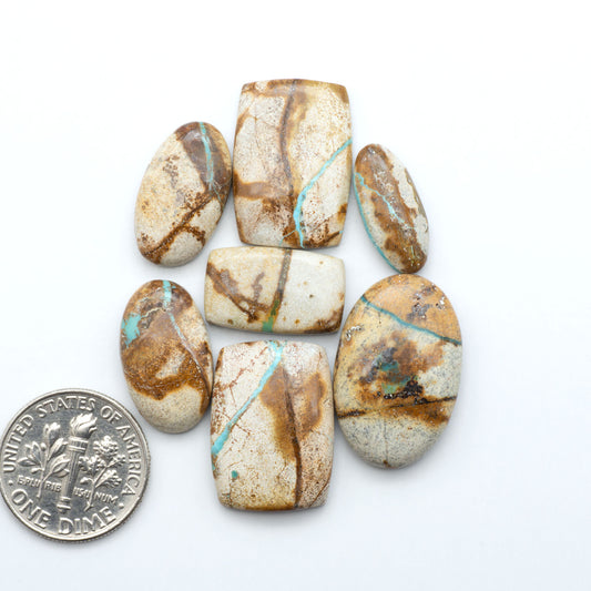 Royston Turquoise cabochons are famous for their distinctive matrix and unique green and blue hues, making them a favored option among jewelry designers.