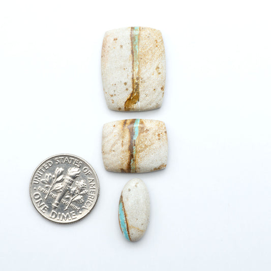 Royston Turquoise cabochons are famous for their distinctive matrix and unique green and blue hues, making them a favored option among jewelry designers.