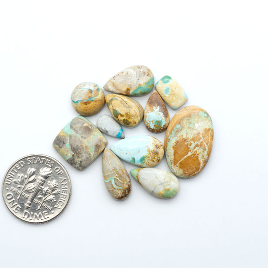 Royston Turquoise cabochons are famous for their distinctive matrix and unique green and blue hues, making them a favored option among jewelry designers.