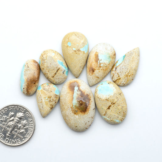 Royston Turquoise cabochons are famous for their distinctive matrix and unique green and blue hues, making them a favored option among jewelry designers.