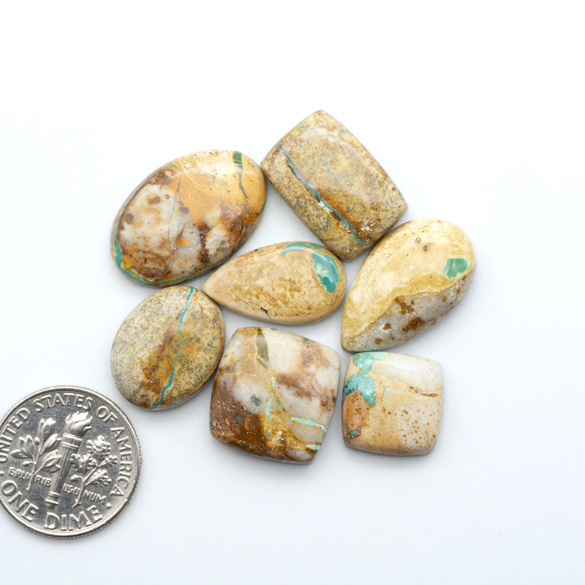 Royston Turquoise cabochons are famous for their distinctive matrix and unique green and blue hues, making them a favored option among jewelry designers.
