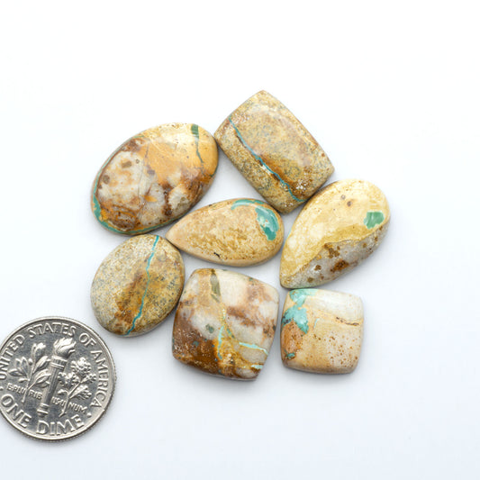 Royston Turquoise cabochons are famous for their distinctive matrix and unique green and blue hues, making them a favored option among jewelry designers.