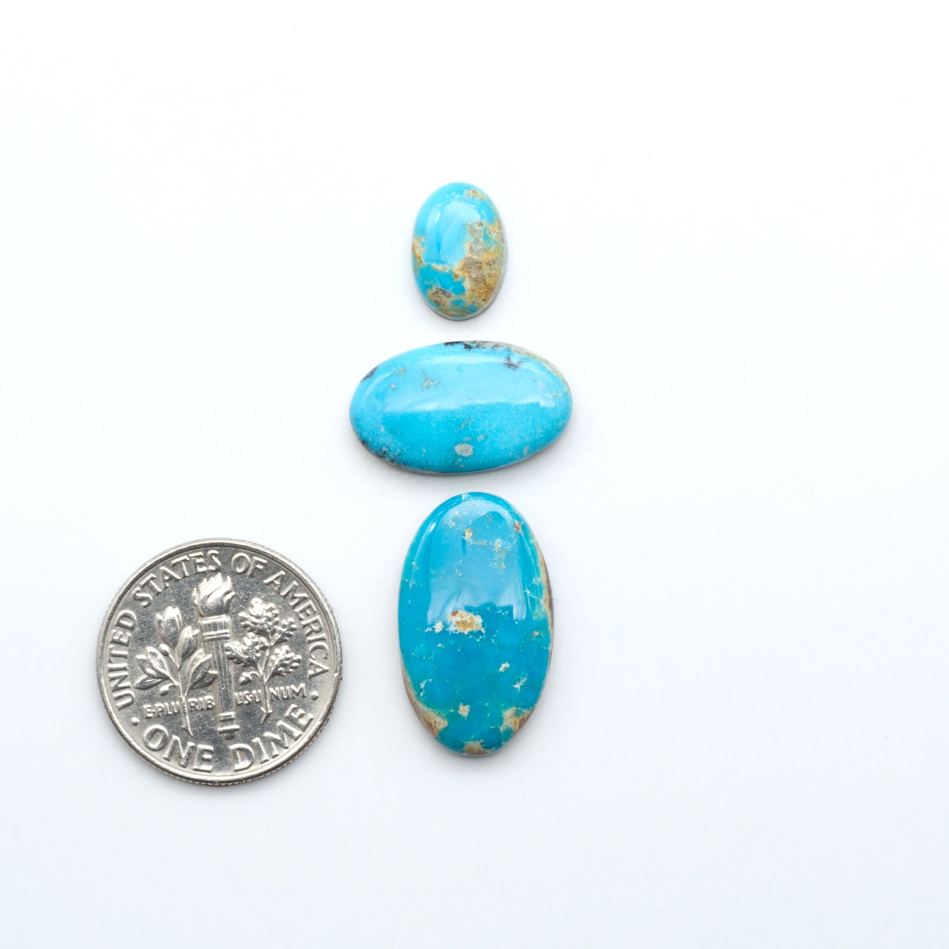 Royston Turquoise cabochons are famous for their distinctive matrix and unique green and blue hues, making them a favored option among jewelry designers.
