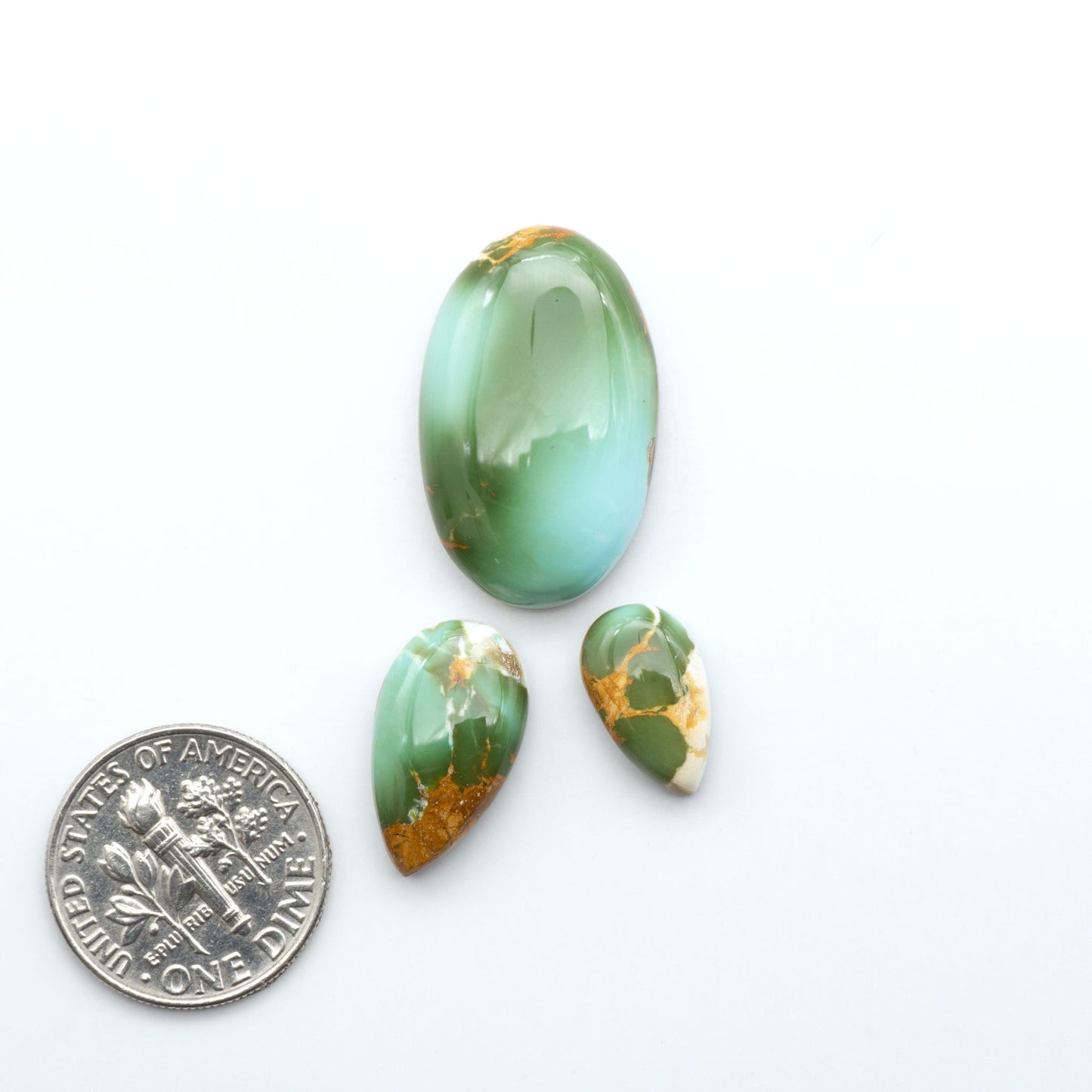 Royston Turquoise cabochons are famous for their distinctive matrix and unique green and blue hues, making them a favored option among jewelry designers.