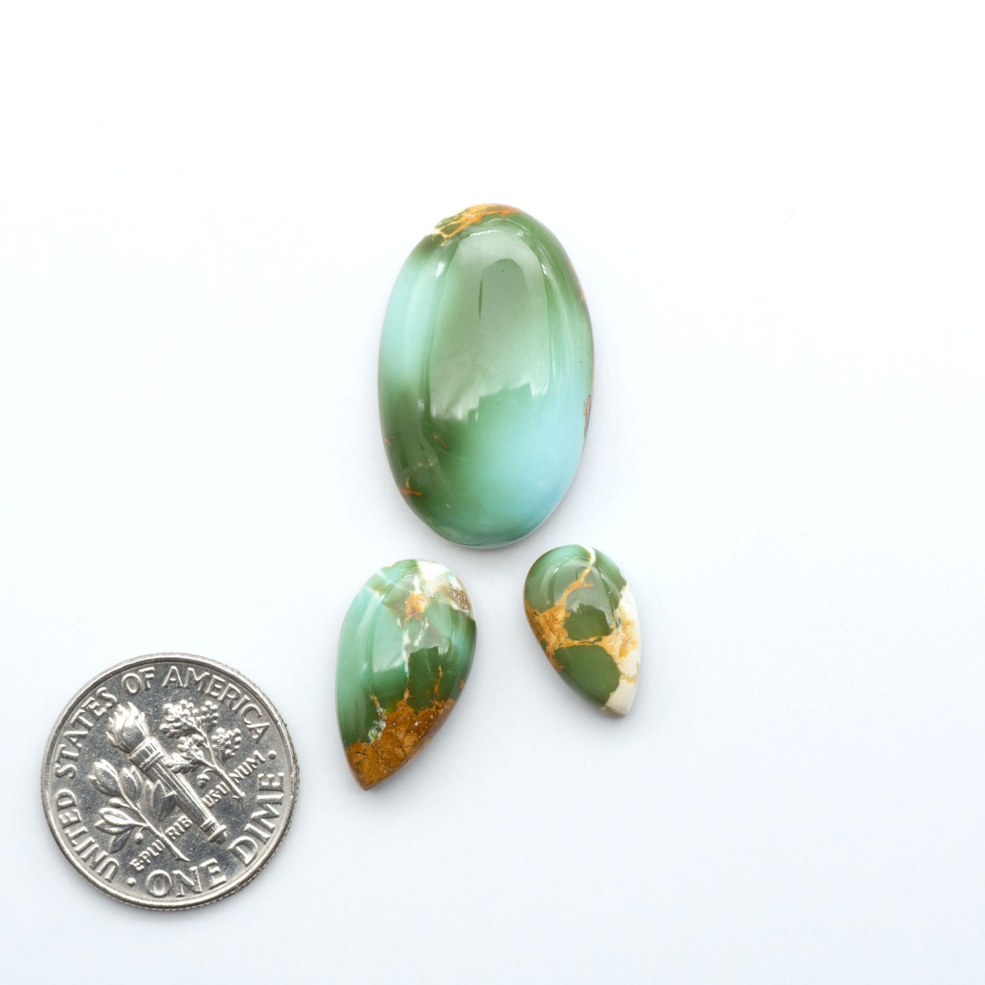 Royston Turquoise cabochons are famous for their distinctive matrix and unique green and blue hues, making them a favored option among jewelry designers.
