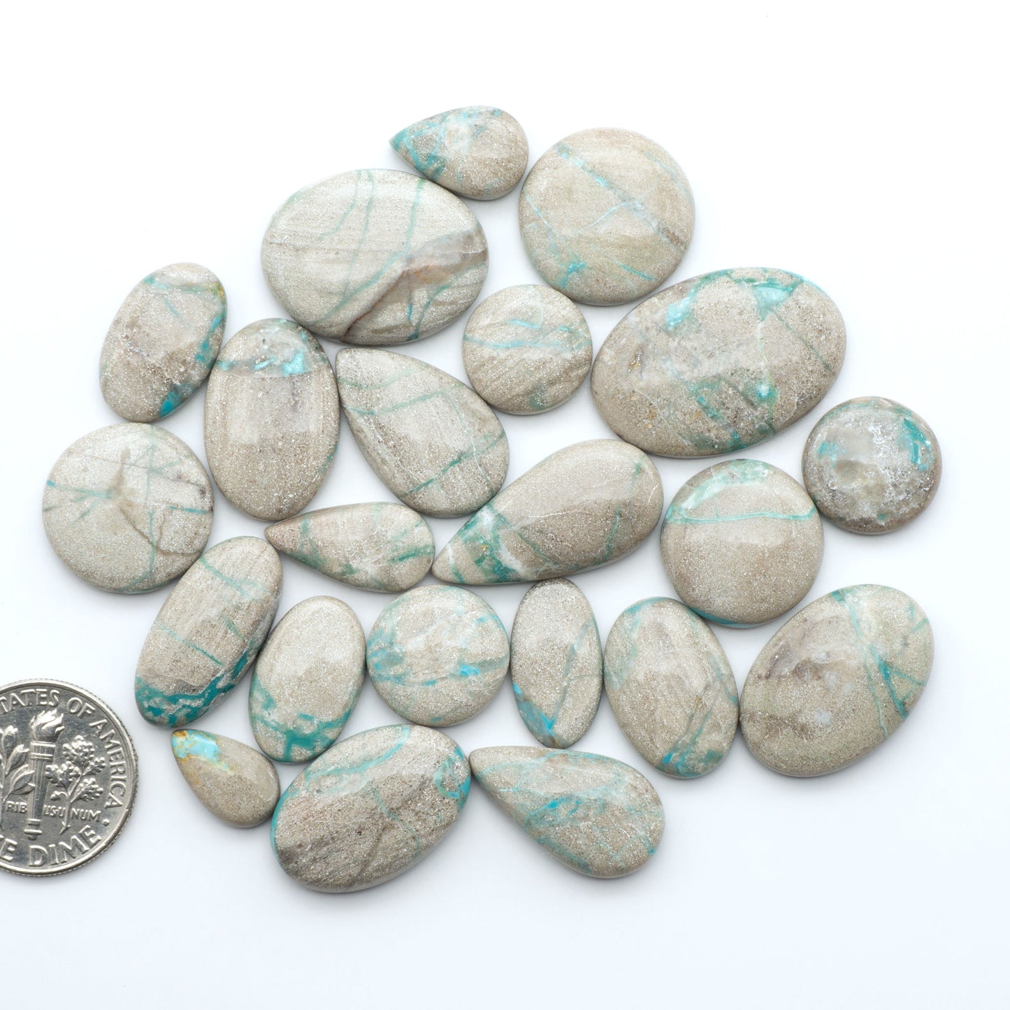 Carico Lake Turquoise cabochons with vibrant aqua-blue to turquoise tones and natural matrix, ideal for rings, pendants, and artisan jewelry.