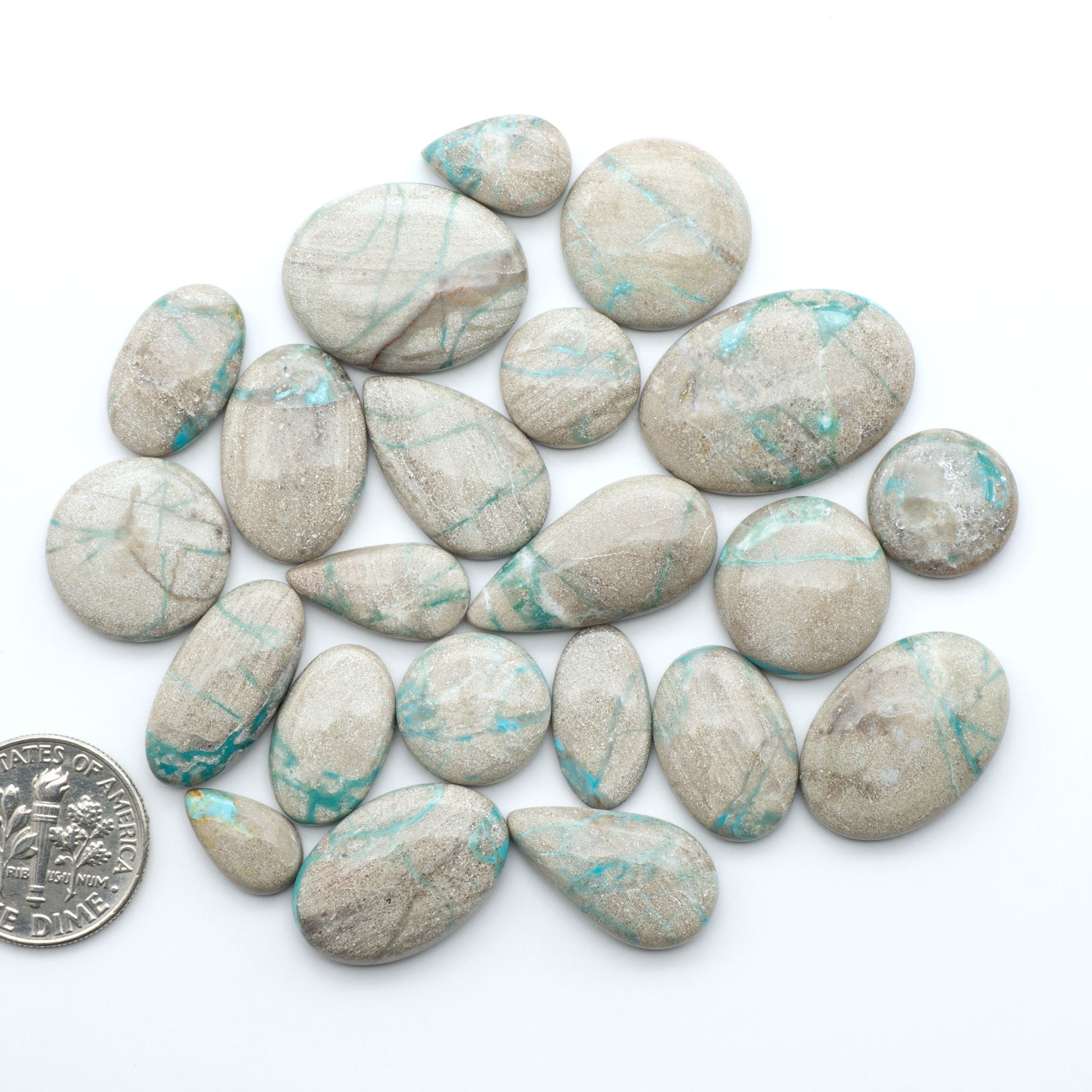 Carico Lake Turquoise cabochons with vibrant aqua-blue to turquoise tones and natural matrix, ideal for rings, pendants, and artisan jewelry.