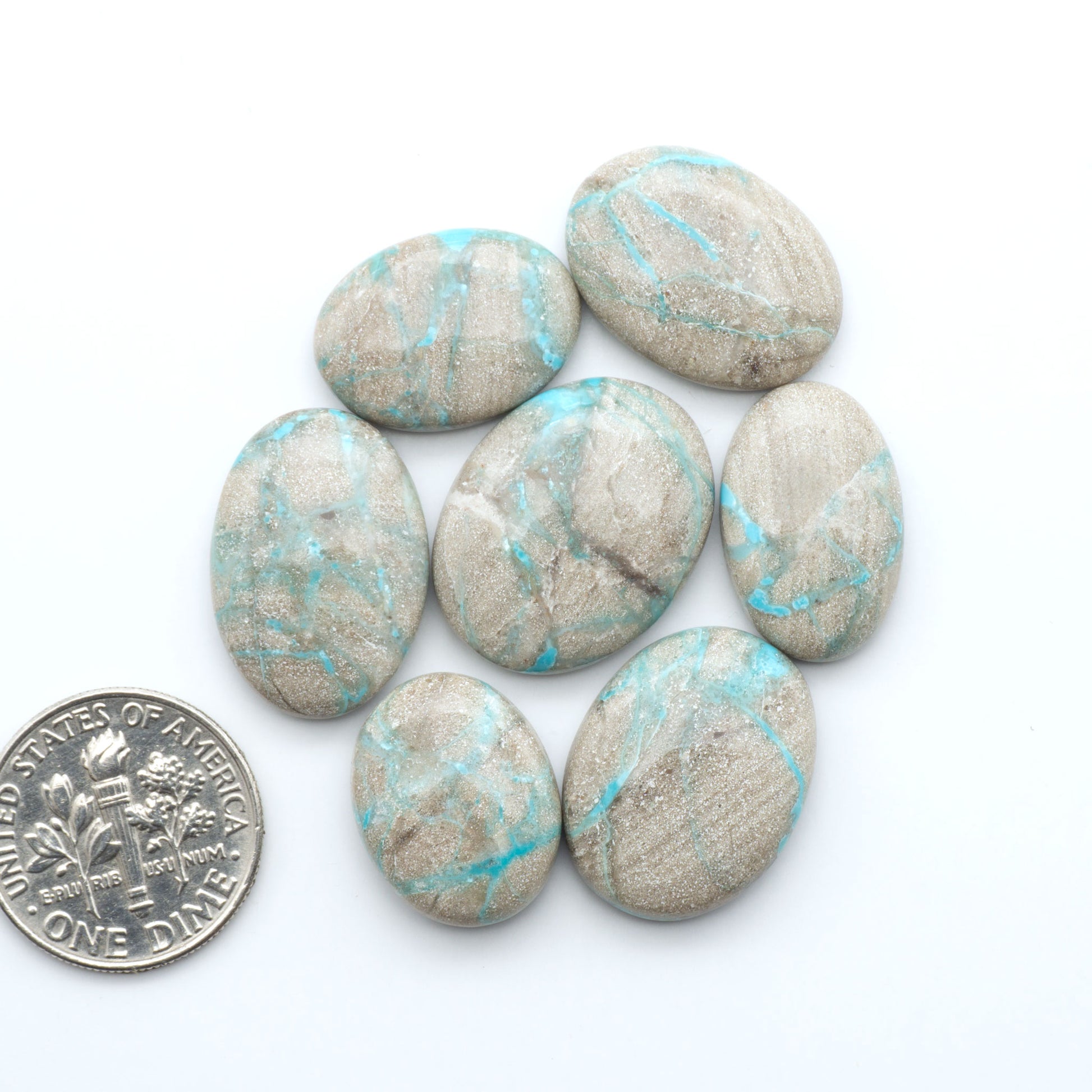 Carico Lake Turquoise cabochons with vibrant aqua-blue to turquoise tones and natural matrix, ideal for rings, pendants, and artisan jewelry.