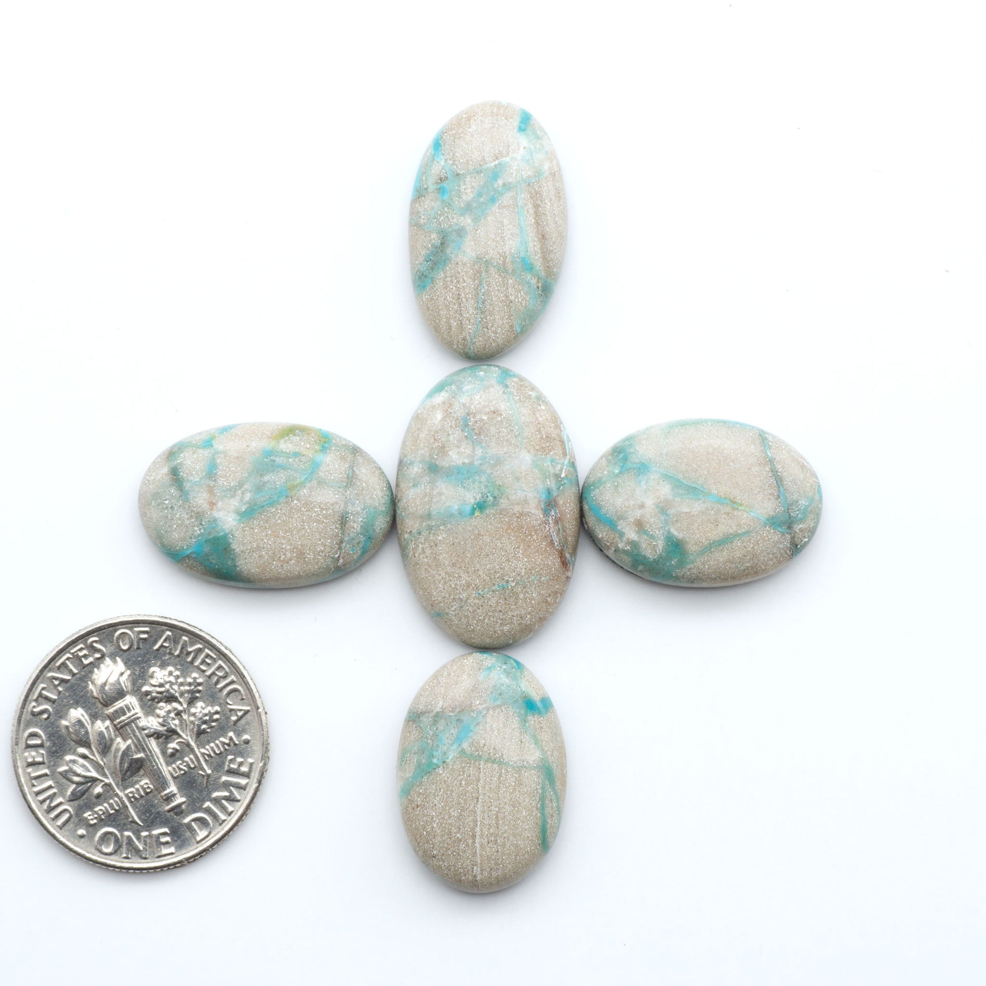 Carico Lake Turquoise cabochons with vibrant aqua-blue to turquoise tones and natural matrix, ideal for rings, pendants, and artisan jewelry.