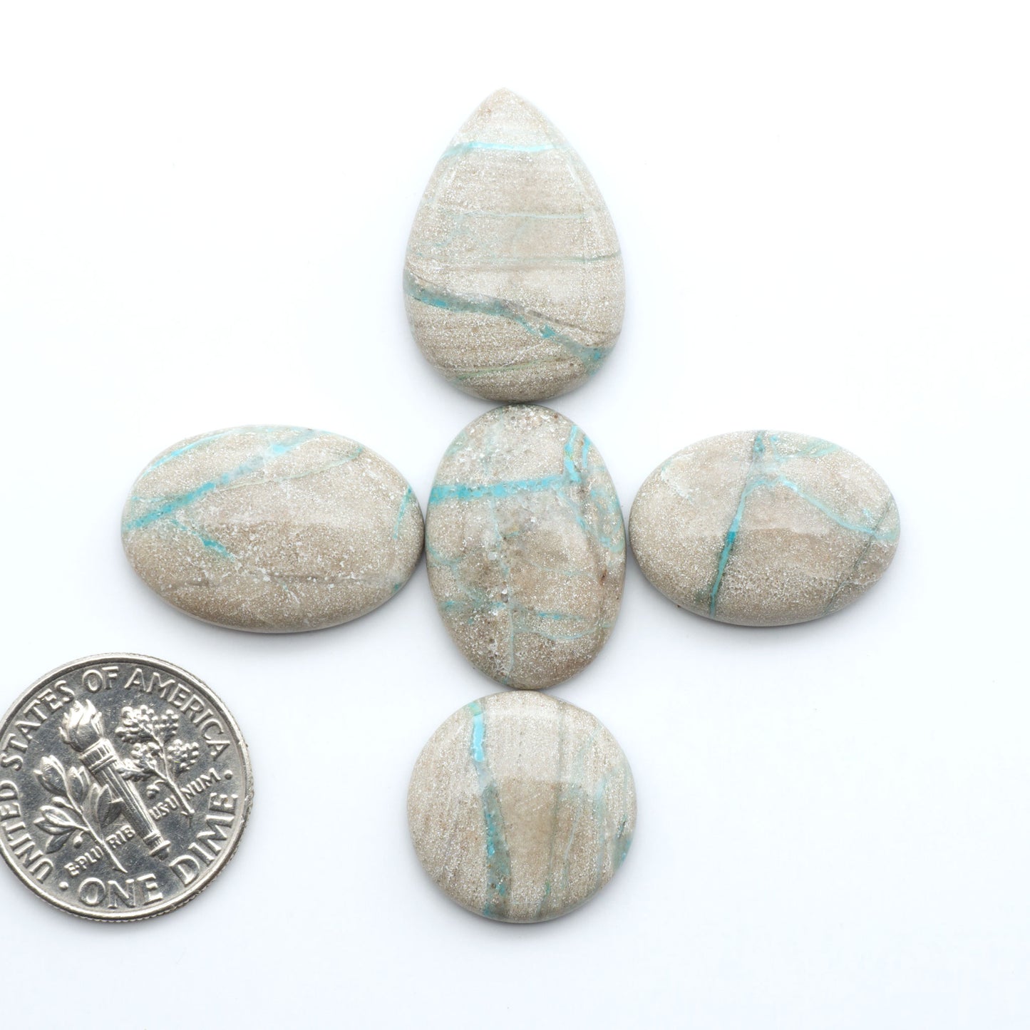 Carico Lake Turquoise cabochons with vibrant aqua-blue to turquoise tones and natural matrix, ideal for rings, pendants, and artisan jewelry.