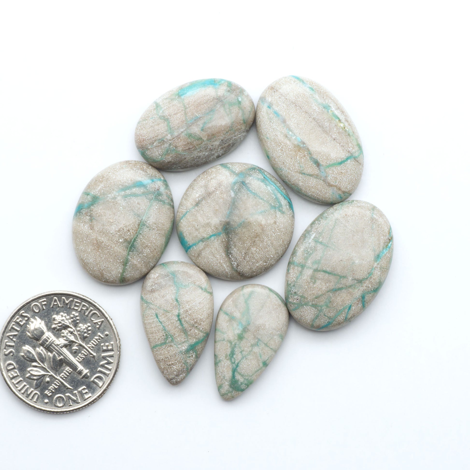Carico Lake Turquoise cabochons with vibrant aqua-blue to turquoise tones and natural matrix, ideal for rings, pendants, and artisan jewelry.