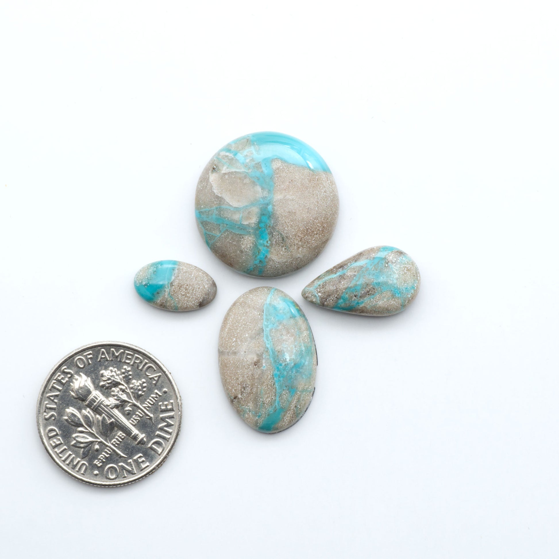 Carico Lake Turquoise cabochons with vibrant aqua-blue to turquoise tones and natural matrix, ideal for rings, pendants, and artisan jewelry.