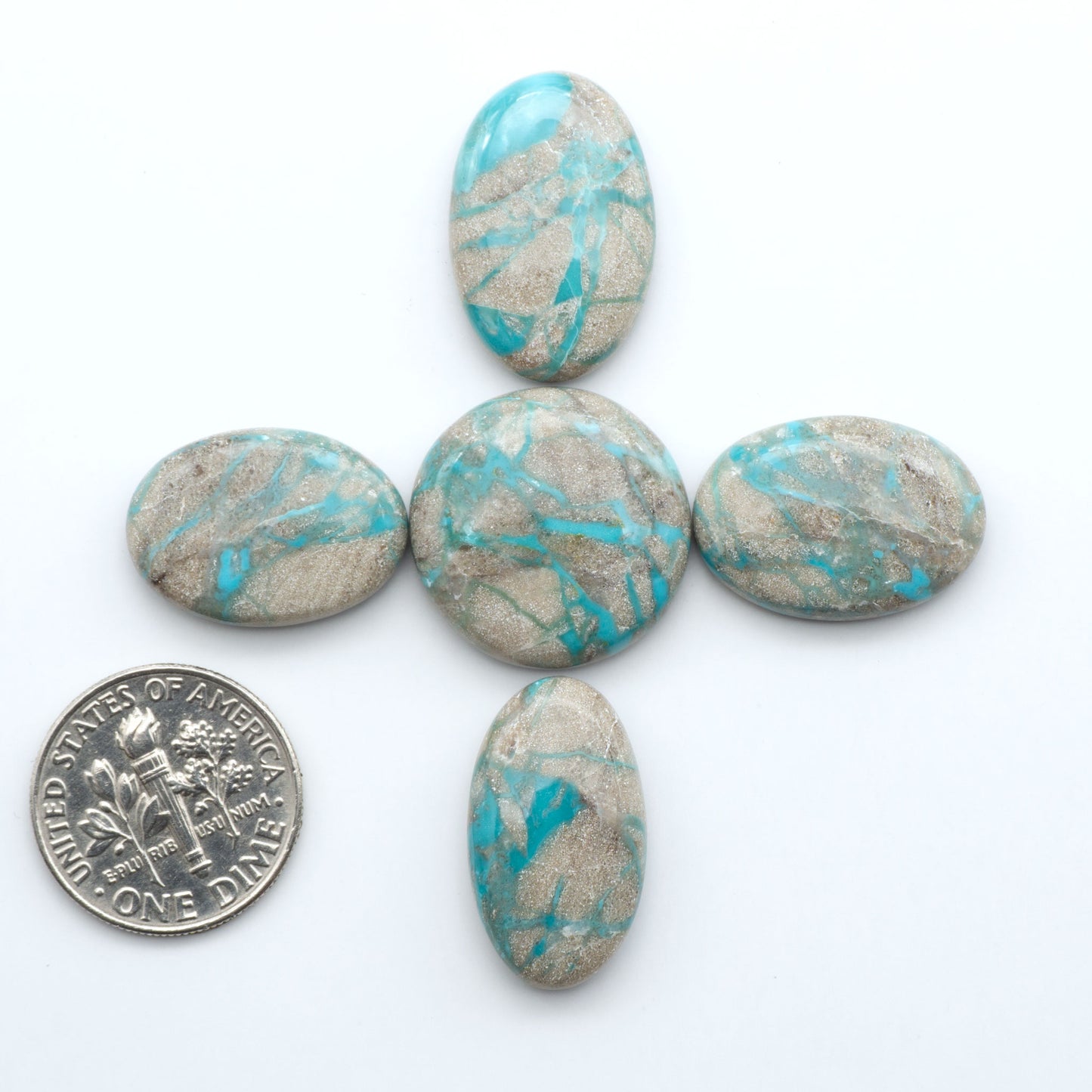 Carico Lake Turquoise cabochons with vibrant aqua-blue to turquoise tones and natural matrix, ideal for rings, pendants, and artisan jewelry.