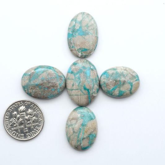 Carico Lake Turquoise cabochons with vibrant aqua-blue to turquoise tones and natural matrix, ideal for rings, pendants, and artisan jewelry.