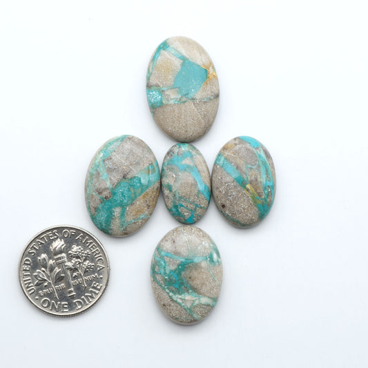 Carico Lake Turquoise cabochons with vibrant aqua-blue to turquoise tones and natural matrix, ideal for rings, pendants, and artisan jewelry.