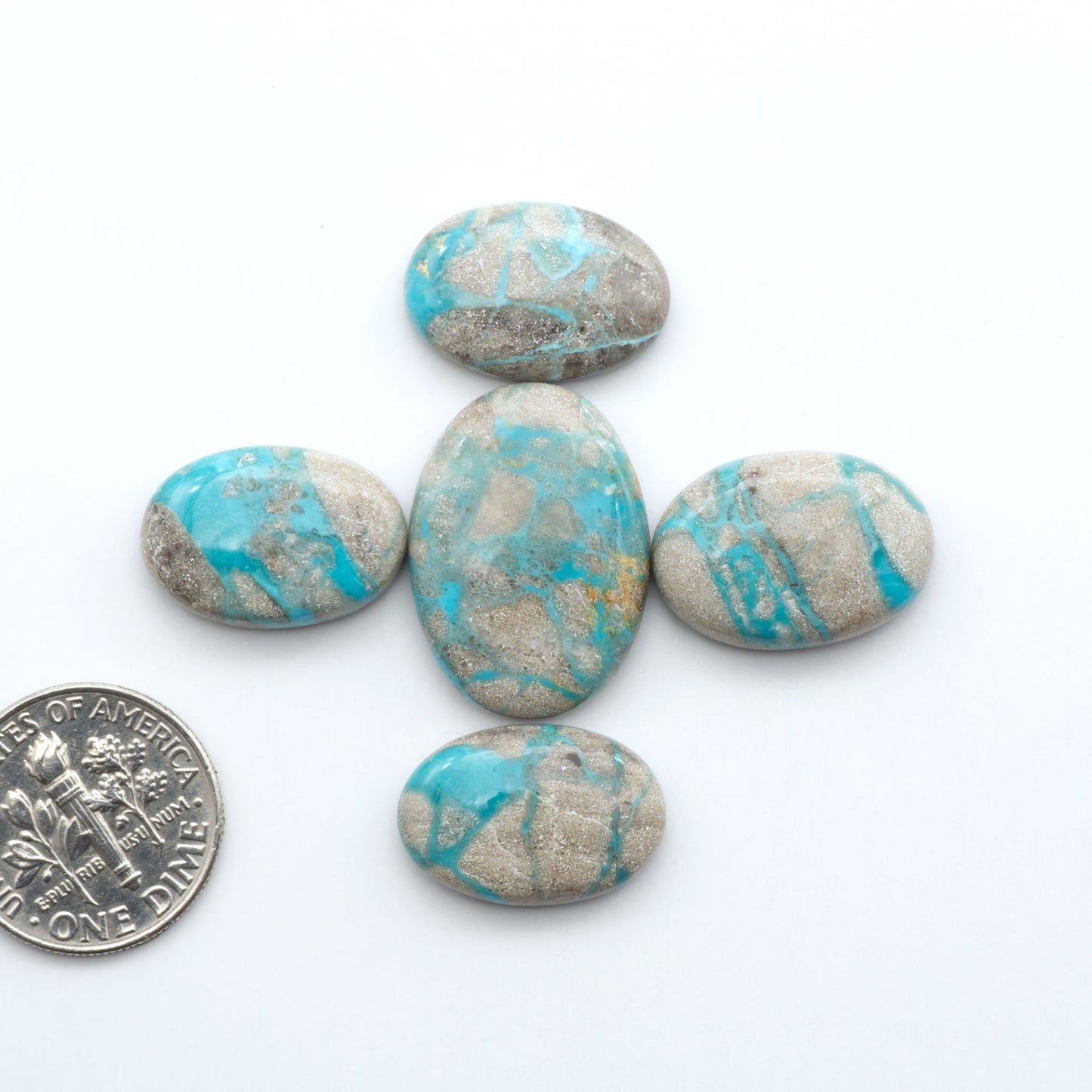 Carico Lake Turquoise cabochons with vibrant aqua-blue to turquoise tones and natural matrix, ideal for rings, pendants, and artisan jewelry.