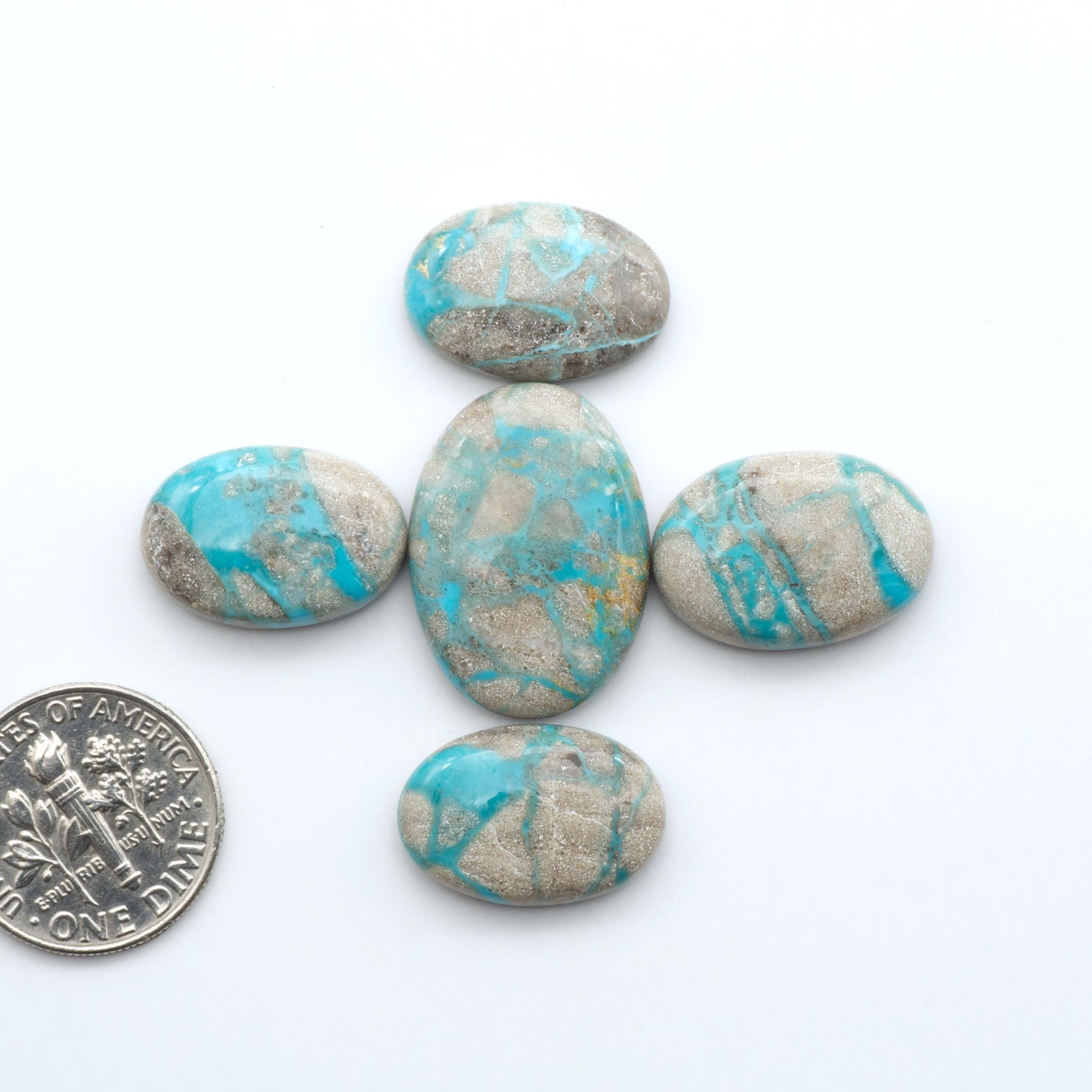 Carico Lake Turquoise cabochons with vibrant aqua-blue to turquoise tones and natural matrix, ideal for rings, pendants, and artisan jewelry.