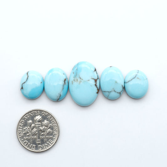 Enhance your jewelry designs with Pressed Turquoise Nugget Cabochons. Crafted from composite materials they add a captivating touch to your creations.