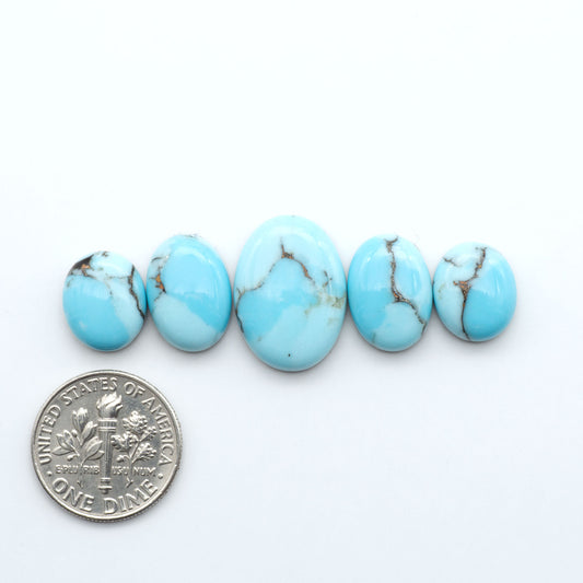 Enhance your jewelry designs with Pressed Turquoise Nugget Cabochons. Crafted from composite materials they add a captivating touch to your creations.
