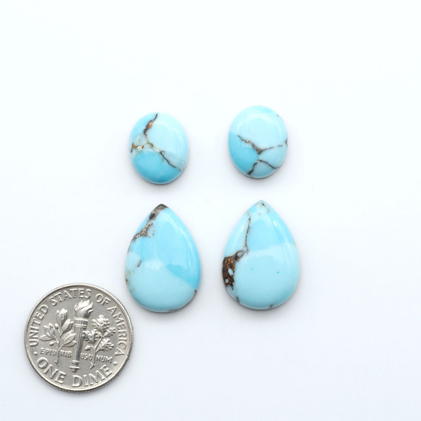 Enhance your jewelry designs with Pressed Turquoise Nugget Cabochons. Crafted from composite materials they add a captivating touch to your creations.