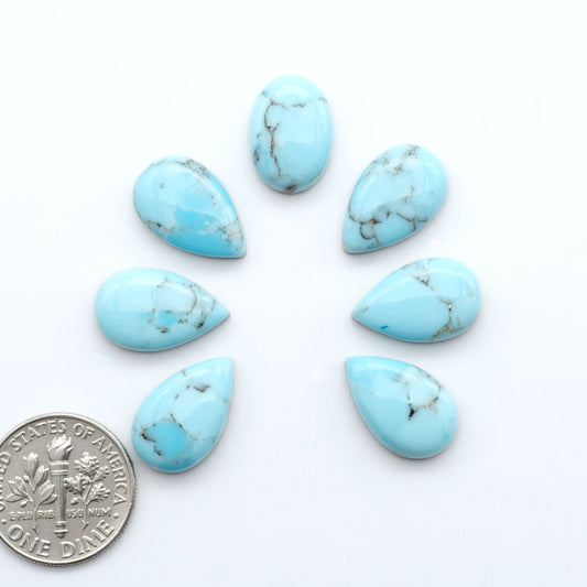 Enhance your jewelry designs with Pressed Turquoise Nugget Cabochons. Crafted from composite materials they add a captivating touch to your creations.