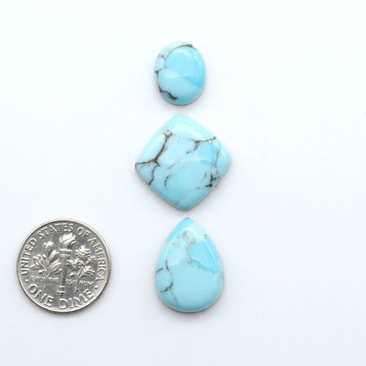 Enhance your jewelry designs with Pressed Turquoise Nugget Cabochons. Crafted from composite materials they add a captivating touch to your creations.