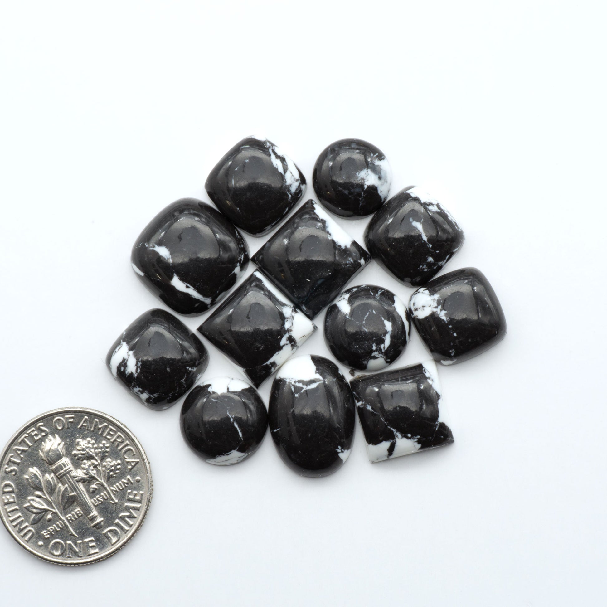 These White Buffalo Cabochons are expertly cut and polished from composite material, resulting in a stunning and long-lasting gemstone.