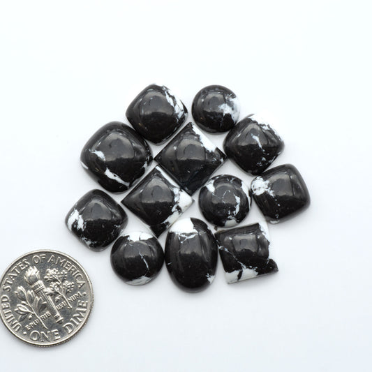 These White Buffalo Cabochons are expertly cut and polished from composite material, resulting in a stunning and long-lasting gemstone.