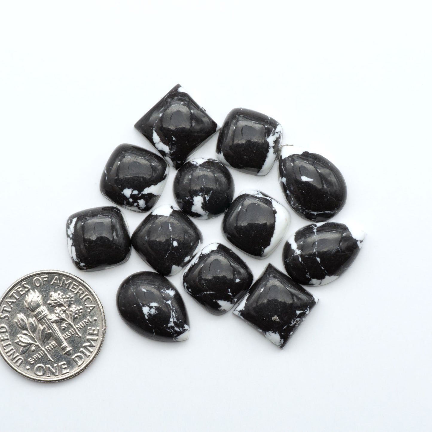 These White Buffalo Cabochons are expertly cut and polished from composite material, resulting in a stunning and long-lasting gemstone.