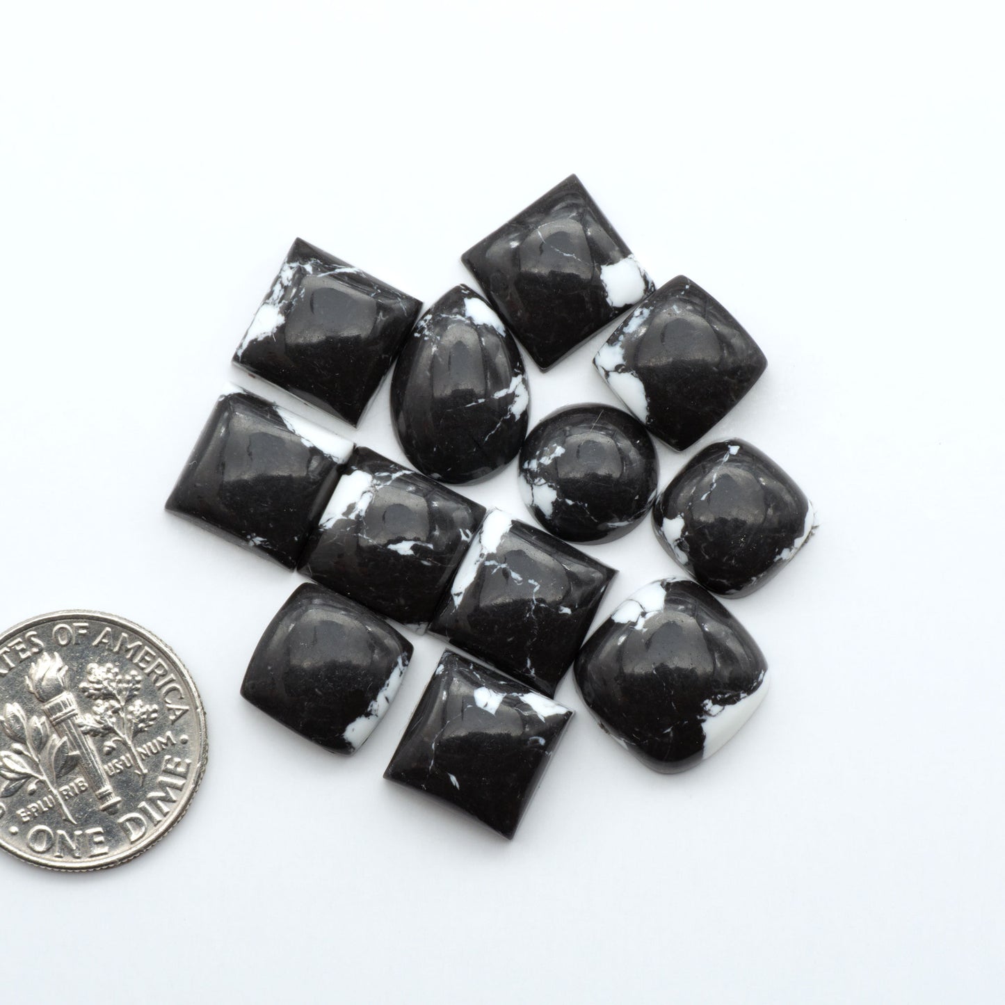 These White Buffalo Cabochons are expertly cut and polished from composite material, resulting in a stunning and long-lasting gemstone.