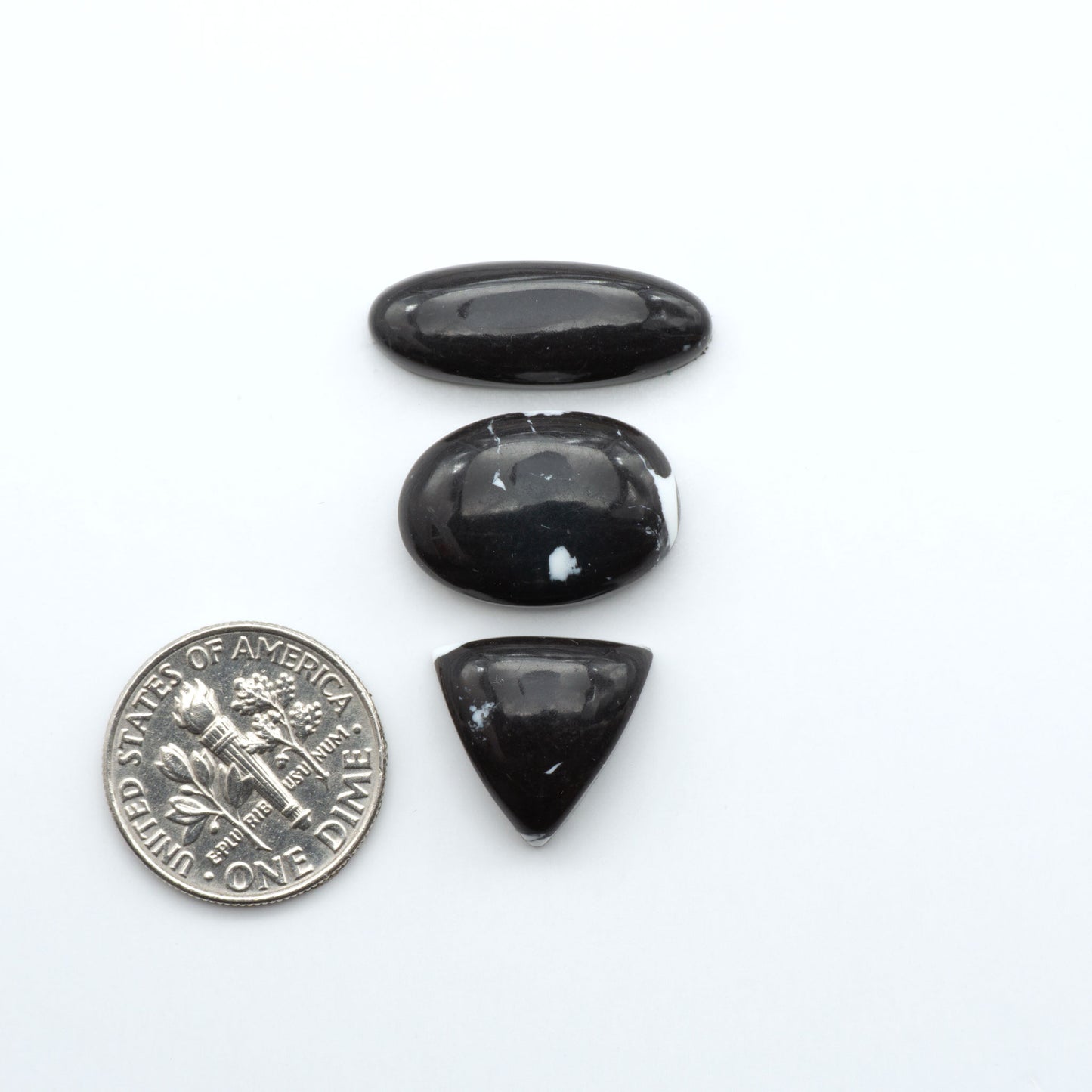 These White Buffalo Cabochons are expertly cut and polished from composite material, resulting in a stunning and long-lasting gemstone.