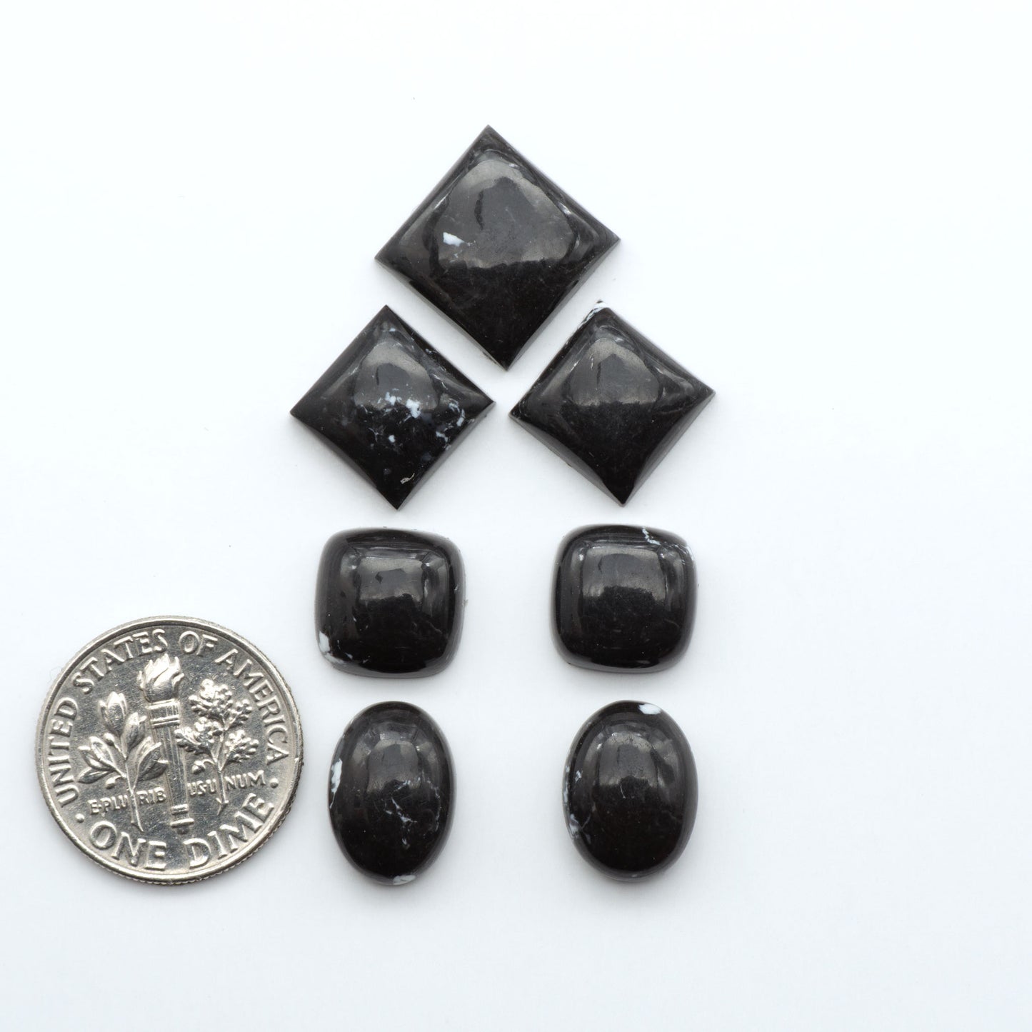 These White Buffalo Cabochons are expertly cut and polished from composite material, resulting in a stunning and long-lasting gemstone.