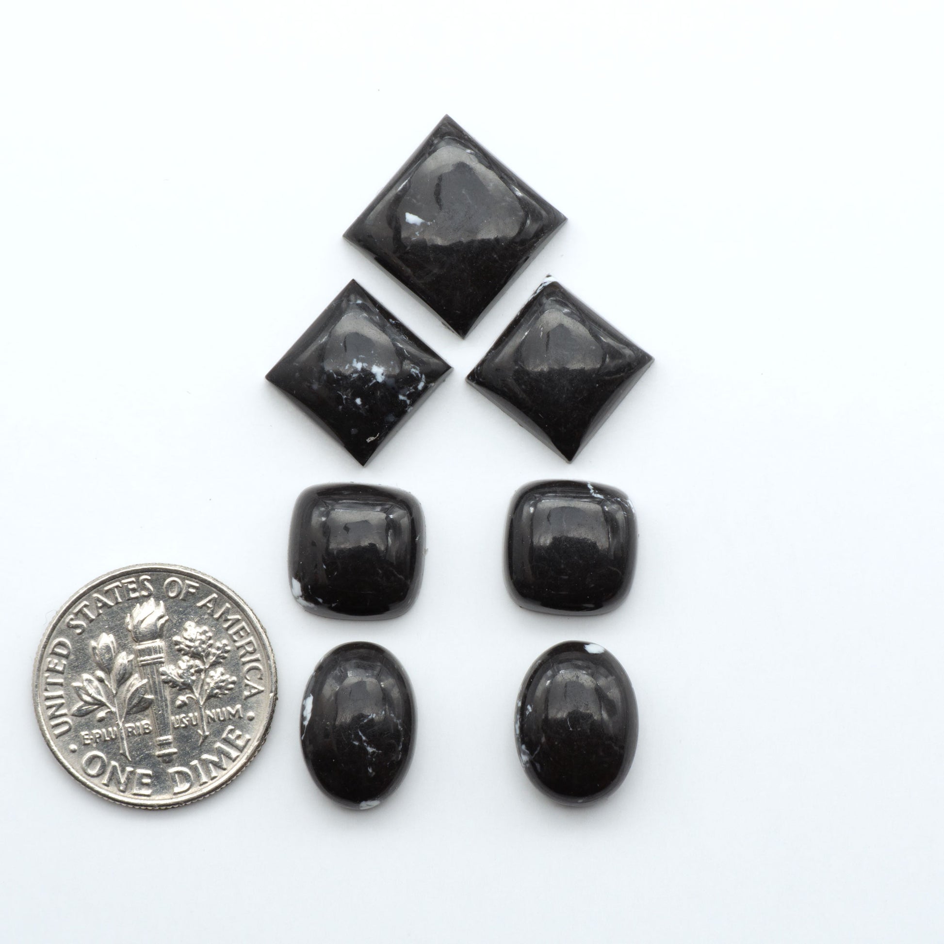 These White Buffalo Cabochons are expertly cut and polished from composite material, resulting in a stunning and long-lasting gemstone.