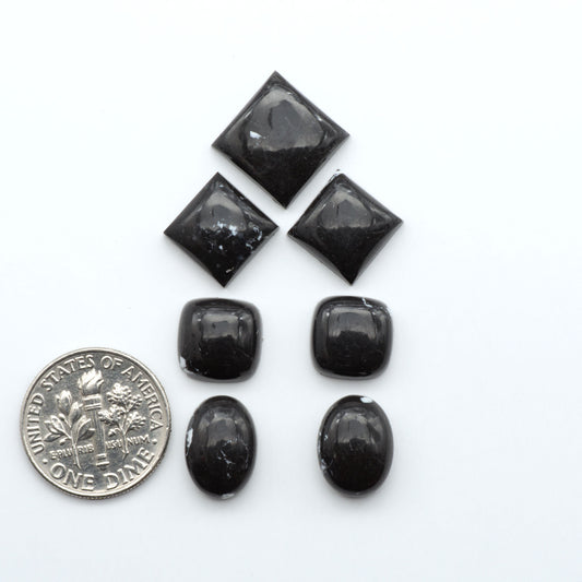 These White Buffalo Cabochons are expertly cut and polished from composite material, resulting in a stunning and long-lasting gemstone.