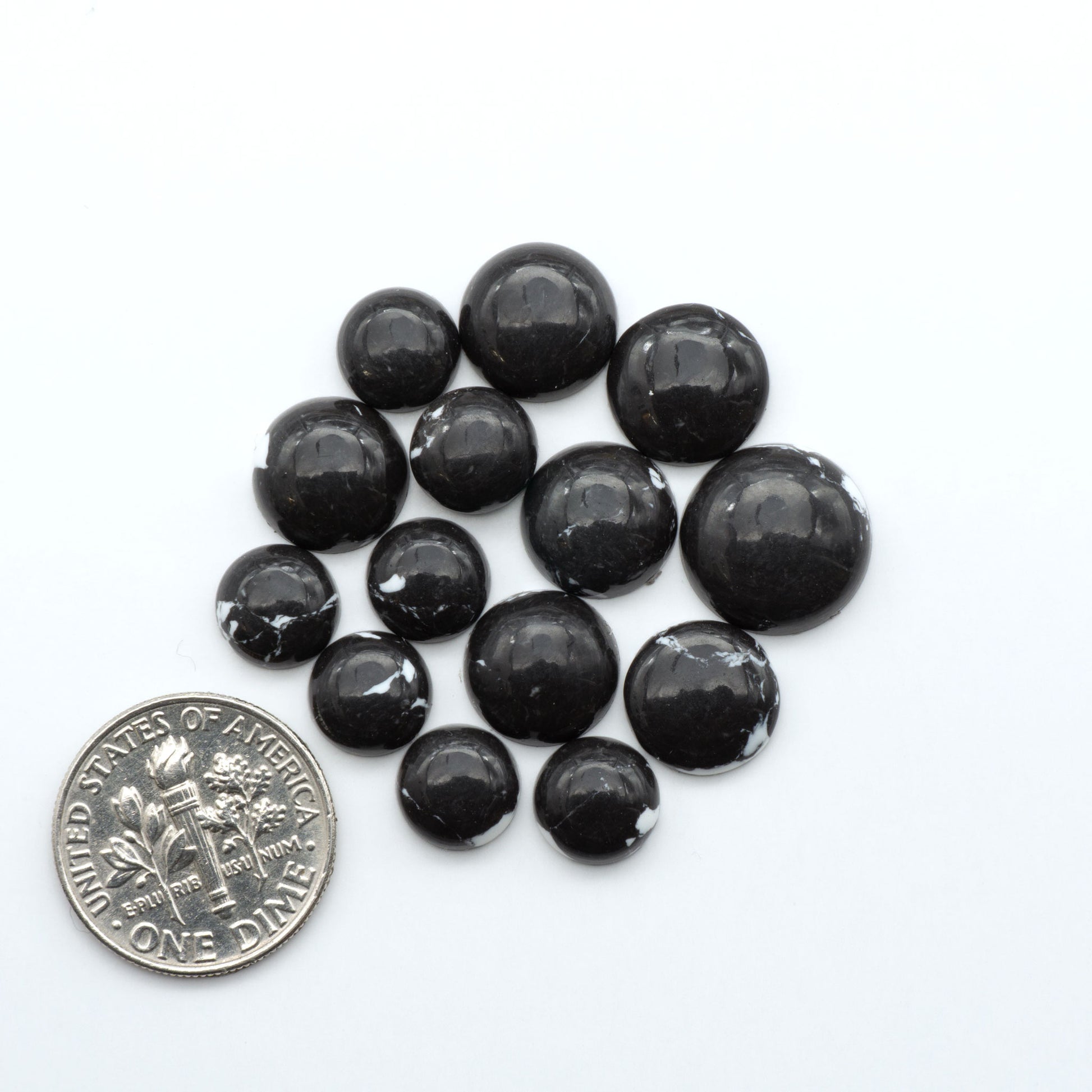 These White Buffalo Cabochons are expertly cut and polished from composite material, resulting in a stunning and long-lasting gemstone.